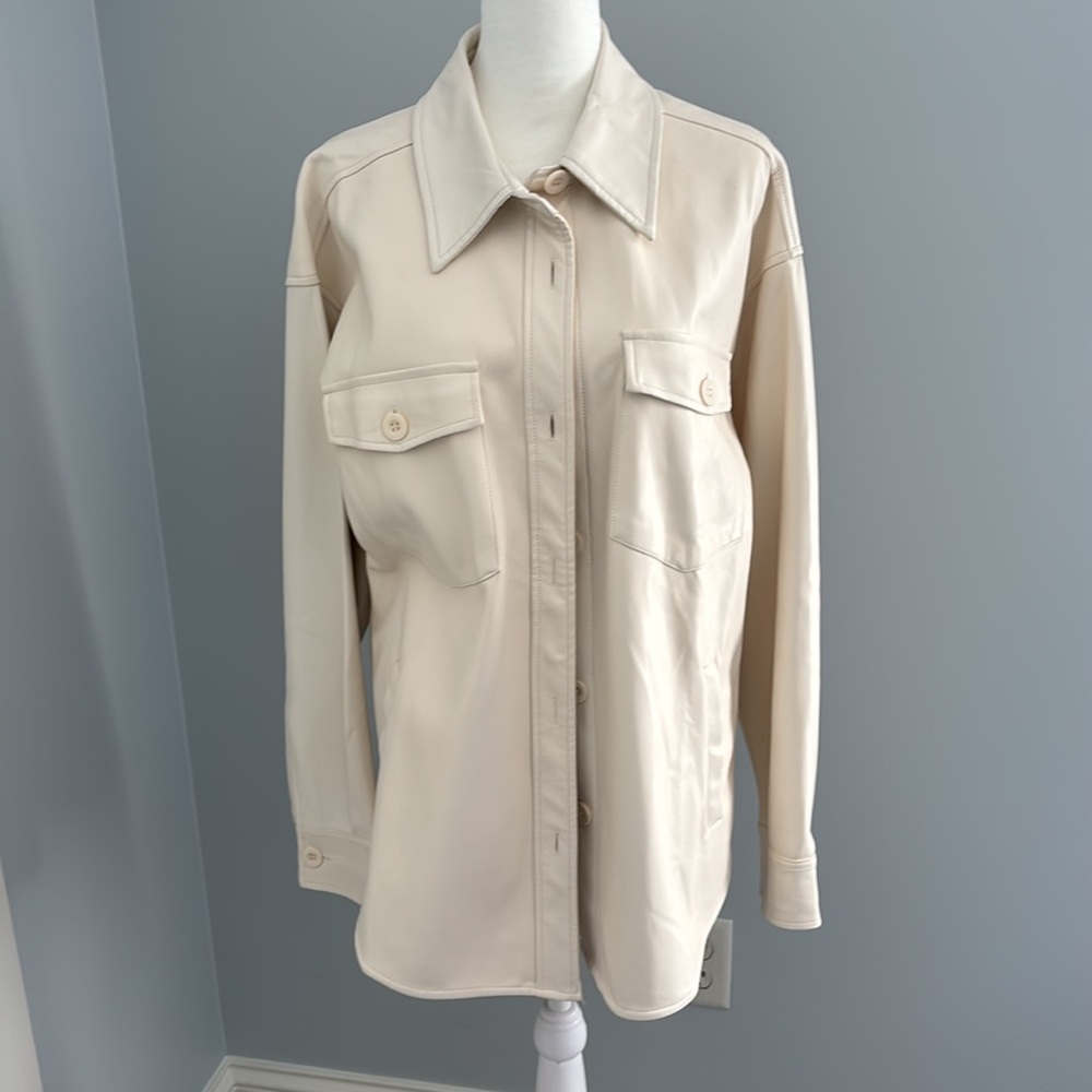 Women’s medium cream, long jacket. Excellent condition brand new.